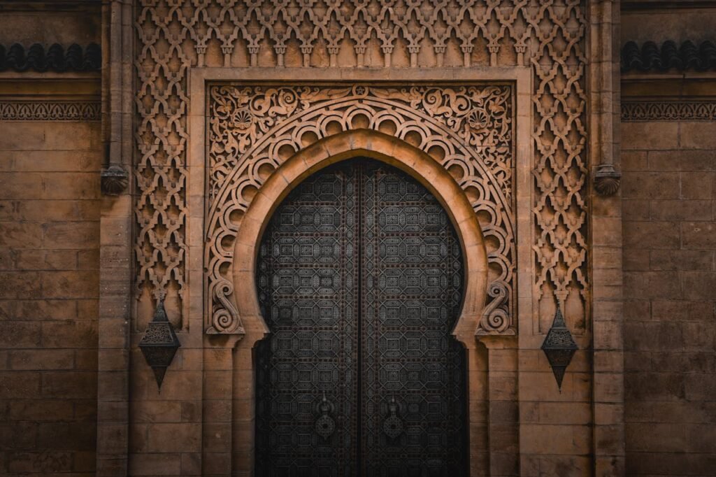 Detailed ornate Moroccan doorway showcasing Islamic architectural style in Rabat, Morocco. Detailed ornate Moroccan doorway showcasing Islamic architectural style in Rabat, Morocco.